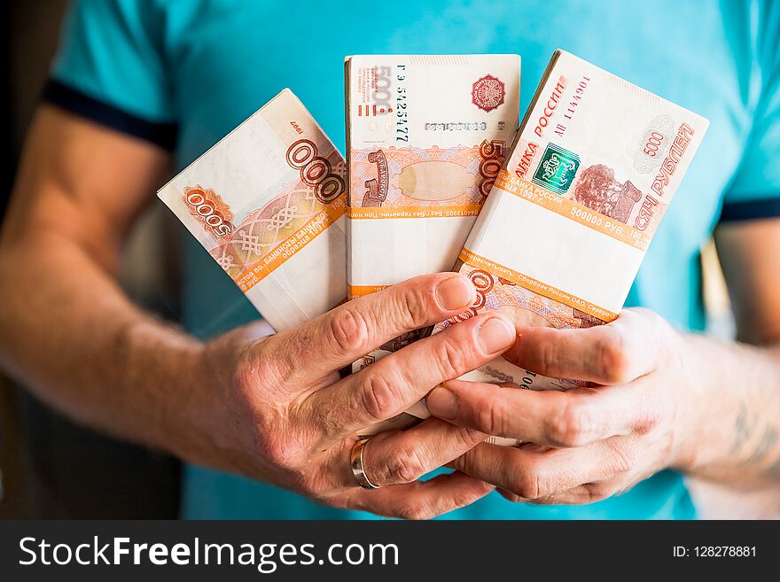 Five-thousandth Banknotes Of The Russian Ruble In A Man`s Hand.male Hand With A Bundle Of Banknotes.The