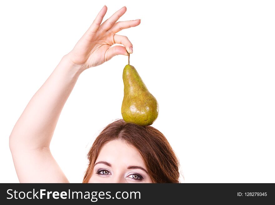 Woman holding on her head green pear fruit, recommend detox fruit diet, isolated on white. Healthy dieting, vegan food, vitamins immunity concept. Woman holding on her head green pear fruit, recommend detox fruit diet, isolated on white. Healthy dieting, vegan food, vitamins immunity concept.