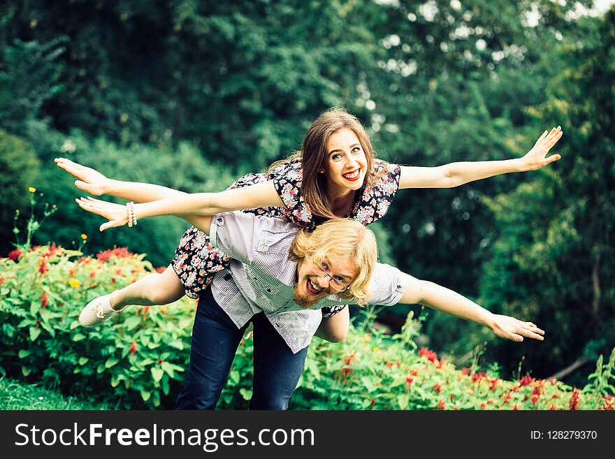 Happy Couple Playing In Park