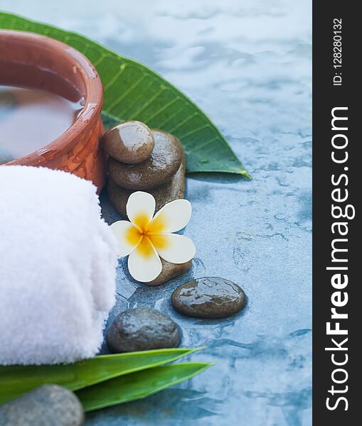 Spa objects with flower and sunlight for massage treatment