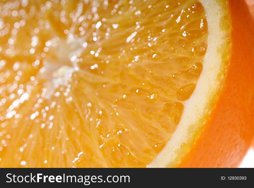 Juicy orange slices in very tasty close-up view. Focus on orange rind. Shallow DoF. Juicy orange slices in very tasty close-up view. Focus on orange rind. Shallow DoF.