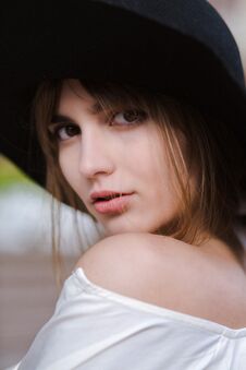 Free Closeup Portrait Of Attractive Young Woman Wearing Black Hat Posing At The City Stock Photography - 128328002
