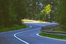 Asphalted Road Leading Up To The Mountains In Forest - Vintage R Stock Photography