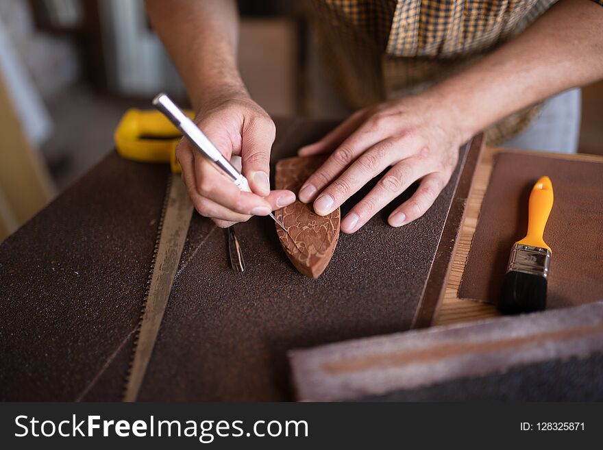 A joiner using his chisel