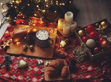 New Year`s Dinner With Cocoa And Croissants Near The Christmas Tree Stock Photo New Year`s Dinner With Cocoa And Croissants Near The Christmas Tree Stock Photo