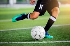 Soccer Player Speed Run To Shoot Ball To Goal On Artificial Turf Stock Images