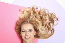 Beautiful Woman With Healthy Long Blonde Hair On Color Background Royalty Free Stock Photos