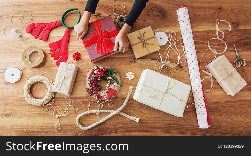 Christmas Presents And Gift Wrapping Equipment On The Table