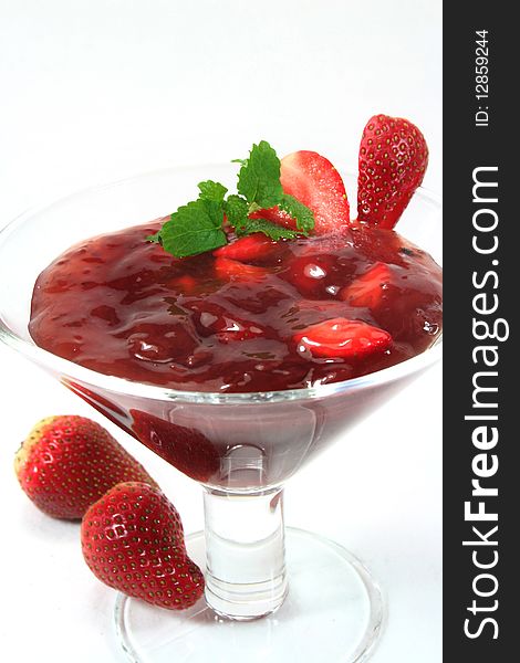 Red fruit jelly with strawberries and lemon balm