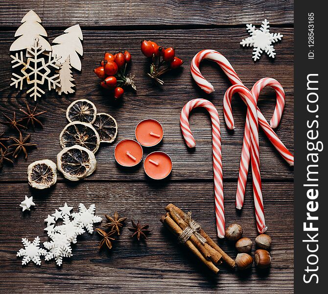 Christmas, New Year, DIY, holidays preparation and creativity concept. Getting ready to celebration. Festive decorations, spices, candy canes, flat lay. Christmas, New Year, DIY, holidays preparation and creativity concept. Getting ready to celebration. Festive decorations, spices, candy canes, flat lay