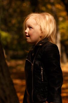 Little Girl In A Leather Jacket Stock Photo
