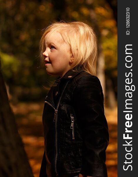 Little girl in a leather jacket