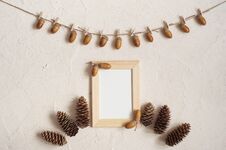 Autumn Composition With Wooden Frame. Acorn With Clothespins On Clothes Line Rope. Wooden Pegs. Flat Lay, Top View, Copy Space. Stock Images Autumn Composition With Wooden Frame. Acorn With Clothespins On Clothes Line Rope. Wooden Pegs. Flat Lay, Top View, Copy Space. Stock Images