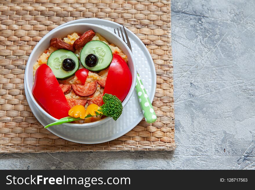 Funny owl mashed potato carrot vegetable puree with sausage