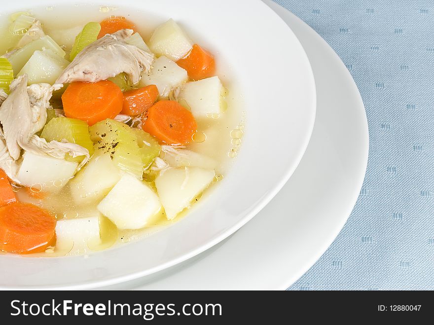 Colorful chicken soup with celery, carrots and potatoes. Colorful chicken soup with celery, carrots and potatoes.