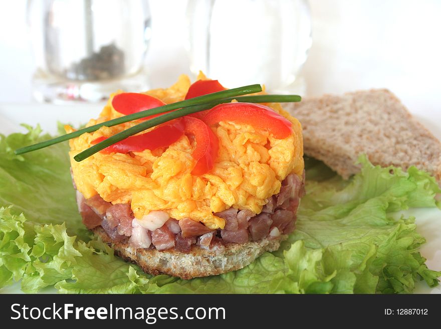 Scrambled eggs on toast and green salad