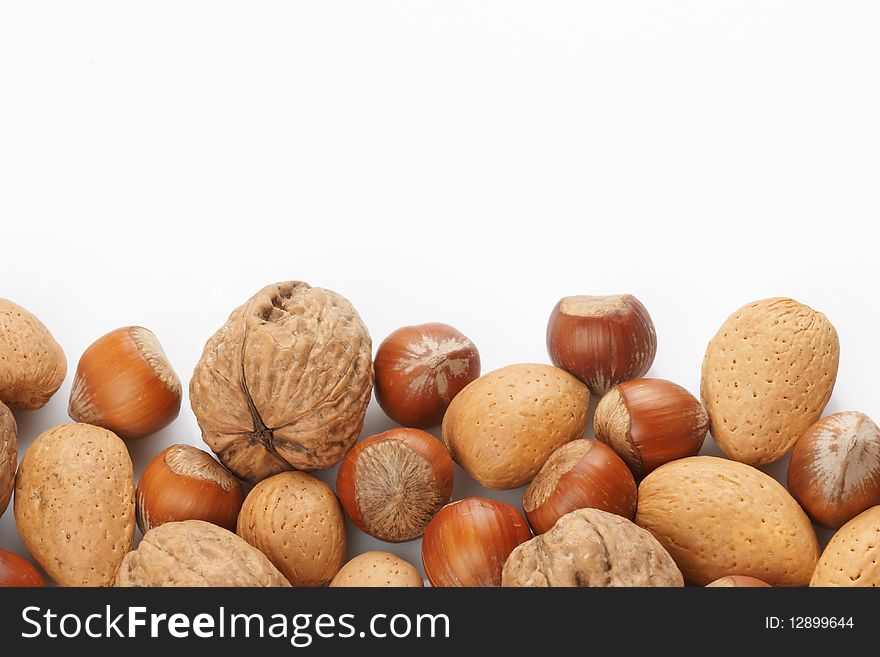 Assortment of nuts displayed on white background