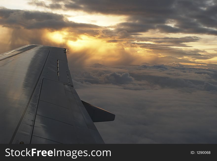 Look out of the airplane window. Look out of the airplane window