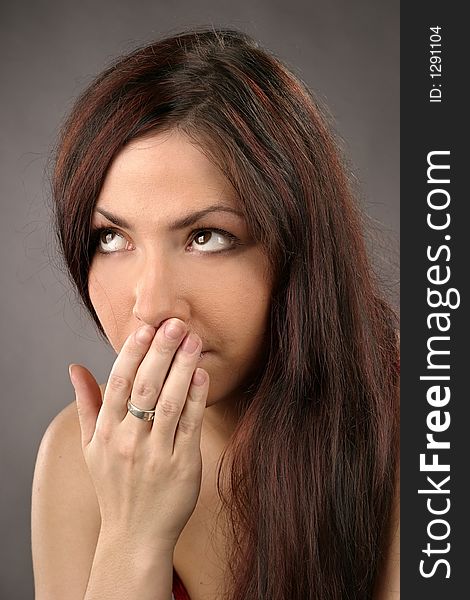 Auburn haired girl, young woman yawning-portrait