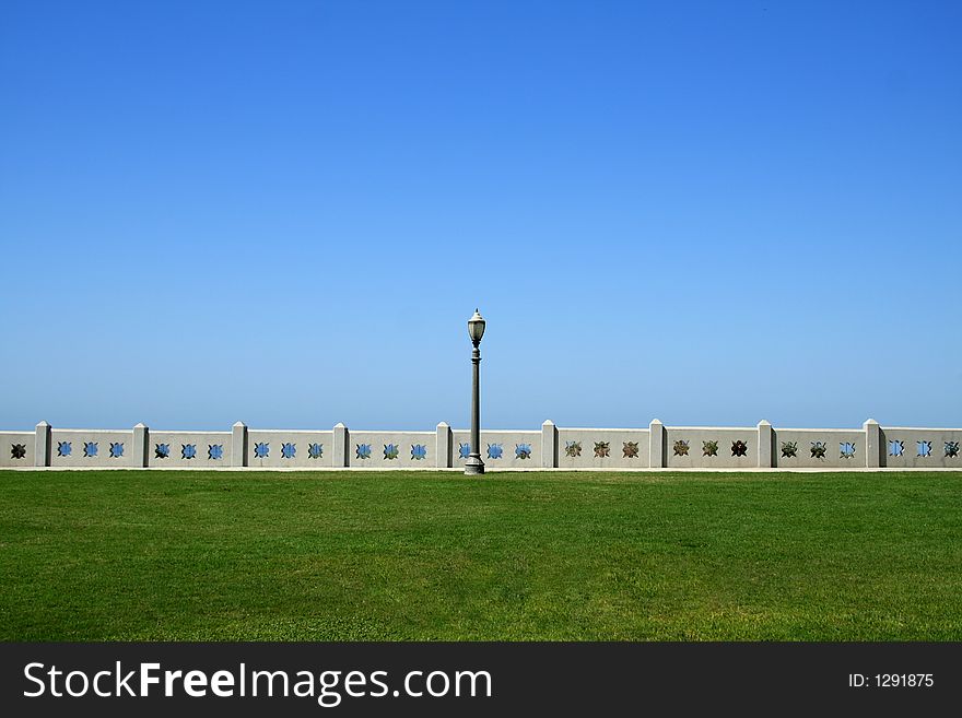 A single lamppost at a park overlooking the Pacific Ocean. A single lamppost at a park overlooking the Pacific Ocean