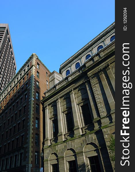 The old mixes with the new in the boston skyline, here, the bright blue sky along the roof tops forms a W. The old mixes with the new in the boston skyline, here, the bright blue sky along the roof tops forms a W.