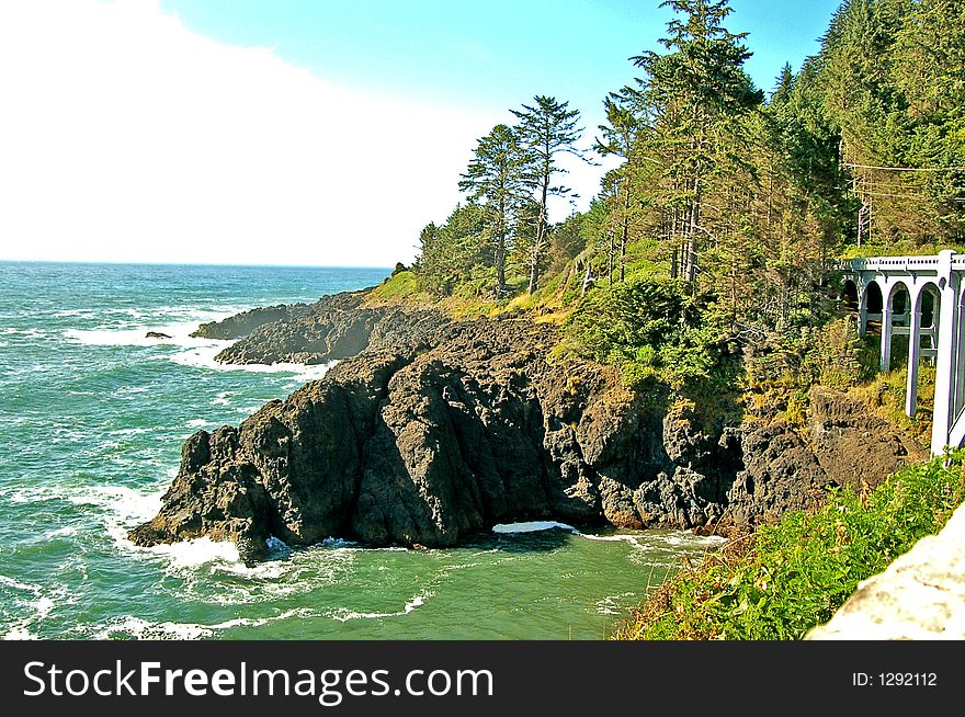 A bridge disappears into the side of a seaside bluff on the Oregon coast. A bridge disappears into the side of a seaside bluff on the Oregon coast.