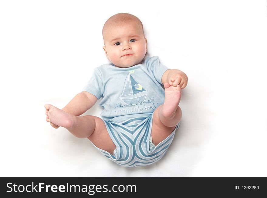 Baby in blue t-shirt playing. Baby in blue t-shirt playing