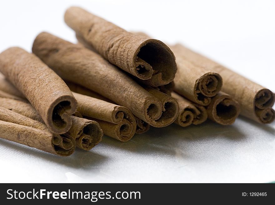 Cinnamon sticks on a white background. Cinnamon sticks on a white background