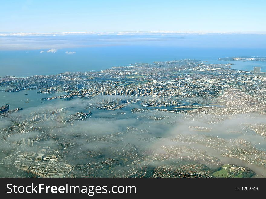 Sydney bay aerial view, with light cloud coverage