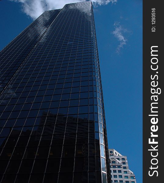 Reflective glass building on congress street in Boston. Reflective glass building on congress street in Boston.