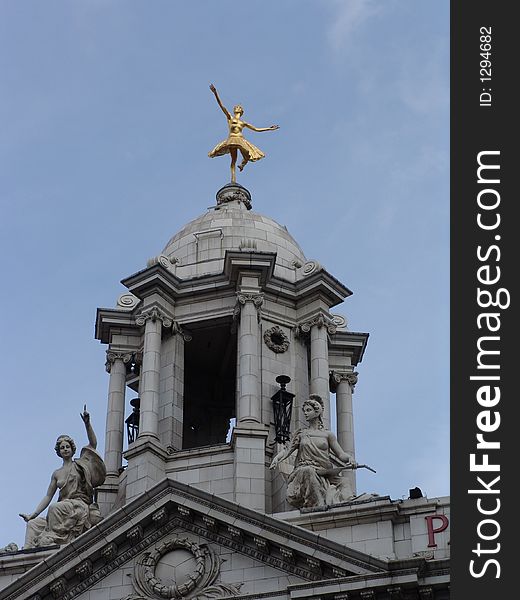 Balerina Statue On Grey Stone Dome With Sculptures