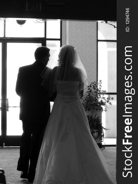 Bride and groom walk out of the darkness. Bride and groom walk out of the darkness