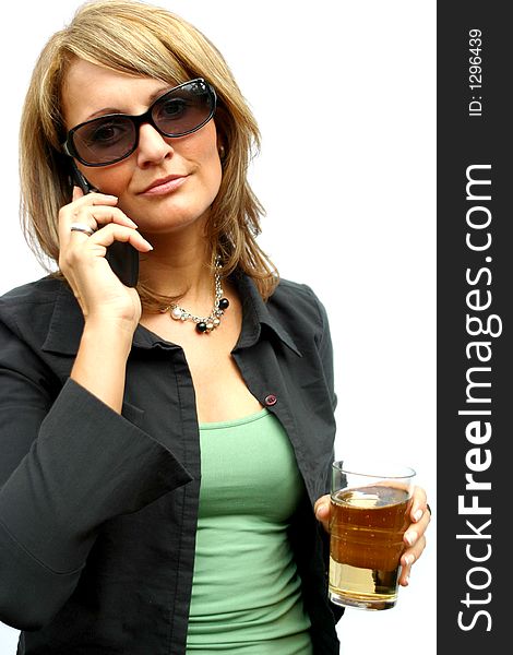 A beautiful Woman with a mobile phone and an glass. A beautiful Woman with a mobile phone and an glass.