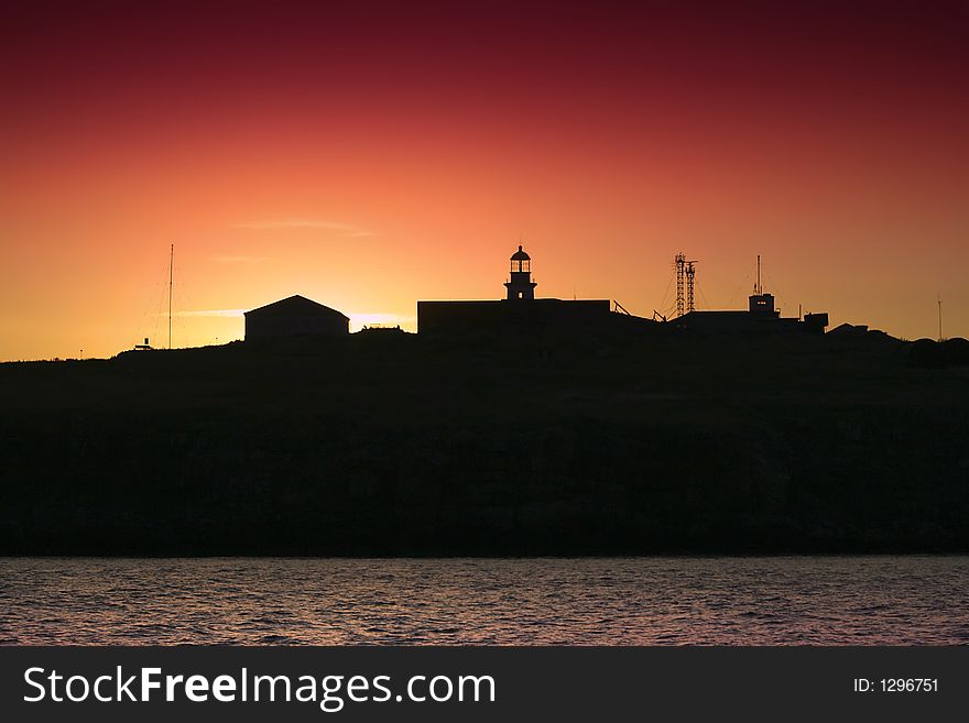 Silhouette of an island and lighthouse