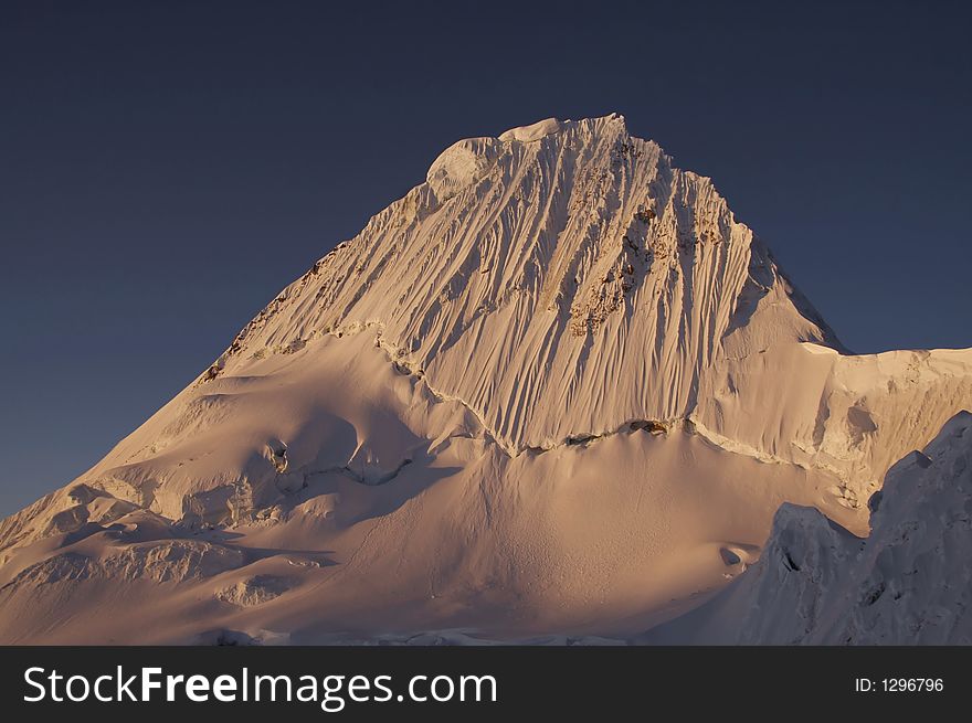 Beautiful summit Alpamayo on the sunset. Beautiful summit Alpamayo on the sunset