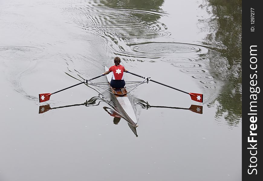 Girl with a red shirt in a skiff. Girl with a red shirt in a skiff