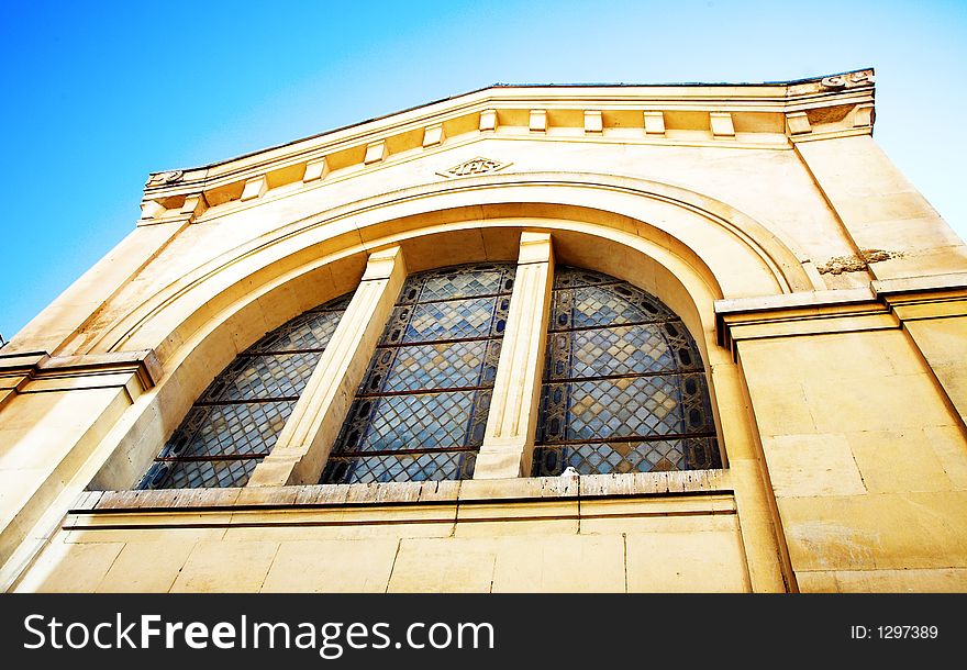 Side shot of an old chapel in France with well preserved stained windows. Side shot of an old chapel in France with well preserved stained windows