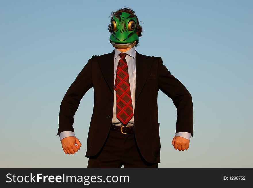 Image of a strong business man with frog mask. Image of a strong business man with frog mask