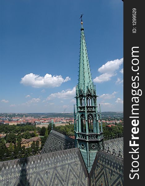 View from the Prague Castle in the Czech Republic with the cathedral central spire in the foreground. View from the Prague Castle in the Czech Republic with the cathedral central spire in the foreground