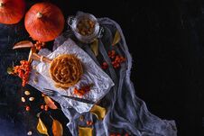 Autumn Concept. Pumpkin Pancakes With Caramel Topping, With Pumpkins, Leaves On A Dark Background. Royalty Free Stock Image Autumn Concept. Pumpkin Pancakes With Caramel Topping, With Pumpkins, Leaves On A Dark Background. Royalty Free Stock Image
