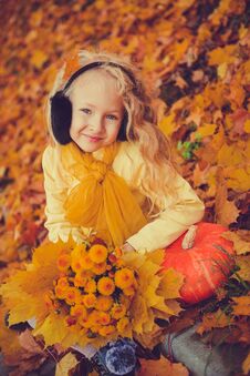 Little Beautiful Blond Girl With Big Pumpkin In Autumn Background Stock Photos
