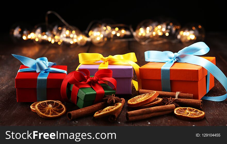 Fragrant star anise and cinnamon on wooden table and christmas gifts. xmas gift concept