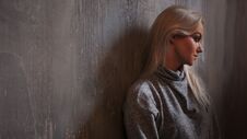 Depressed Woman. Blonde Girl Sitting On The Floor, Sadness And Depression Royalty Free Stock Photography