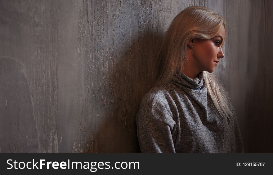 Depressed Woman. Blonde Girl Sitting On The Floor, Sadness And Depression