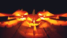 Three Halloween Pumpkins On Dark Background Stock Photography