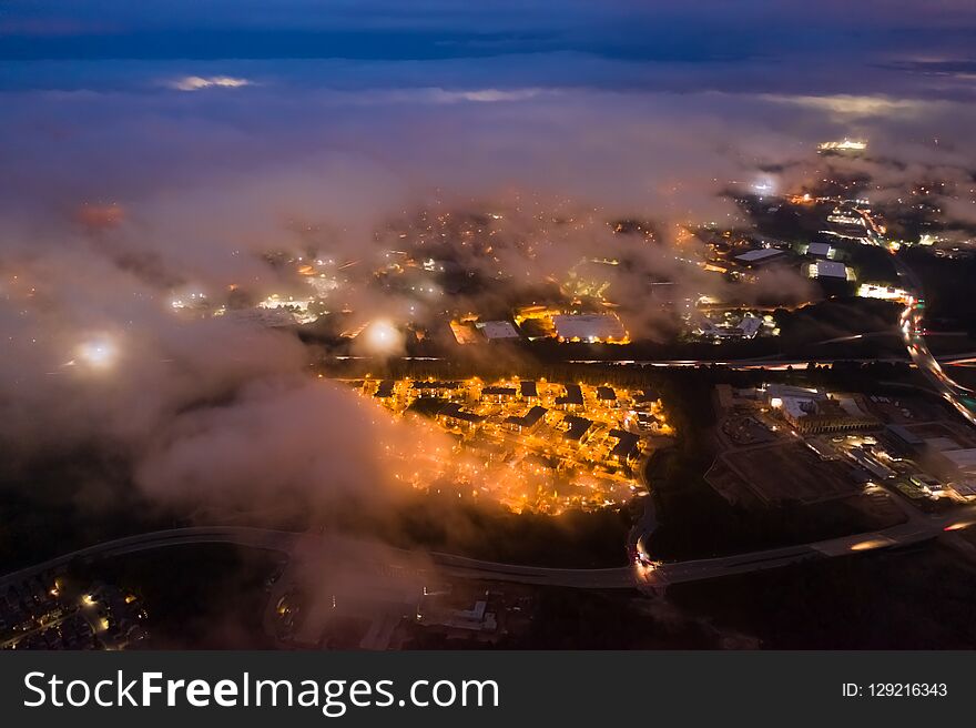 Night Long Exposure Of Suburban Houses And Roads On A Cloudy And Hazy Night