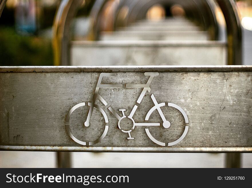 Bicycle sign on the parking. Metall sign. Still life. Bicycle sign on the parking. Metall sign. Still life.