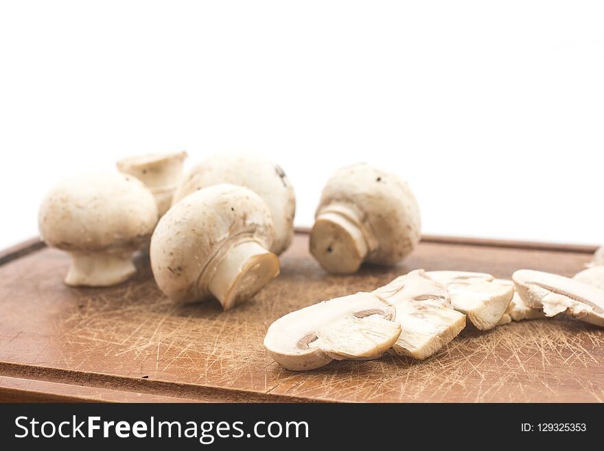 Mushroom champignon sliced isolated on white background