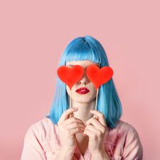 Young Stylish Woman With Blue Hairstyle And Red Lipstick Holding Royalty Free Stock Image