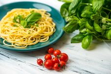 Pasta With Herbs, Basil And Tomatos Served On Green Pate Royalty Free Stock Photo